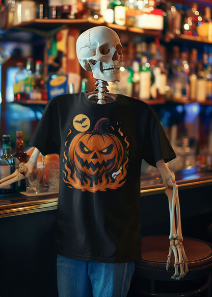 A Halloween-themed black t-shirt displayed on a skeleton mannequin in a bar setting. The t-shirt features a graphic of a glowing jack-o'-lantern pumpkin with orange flames and a full moon on the chest.