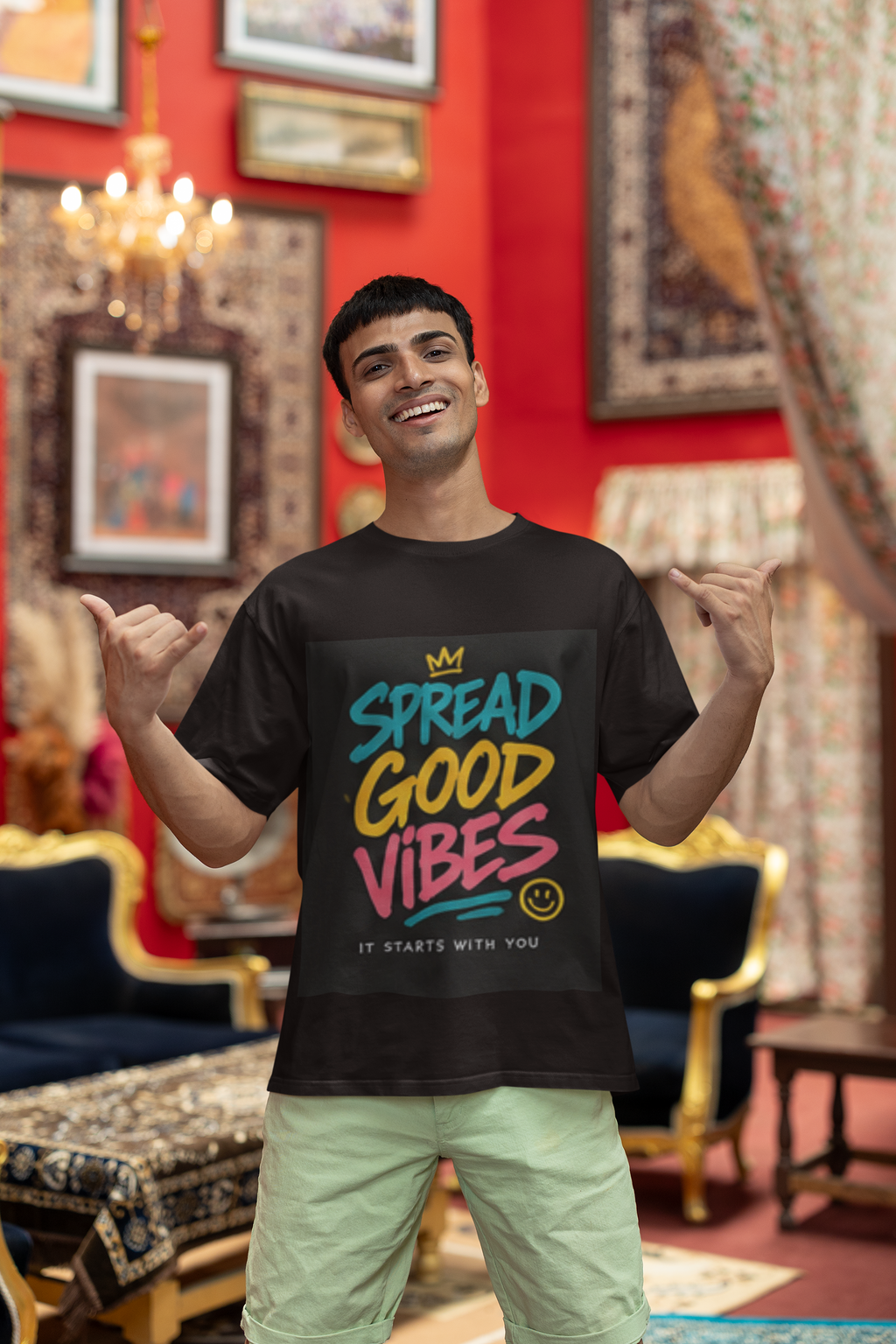 Good Vibes positive message graphic t-shirt worn by blinkstore happy gen man making shaka hand sings