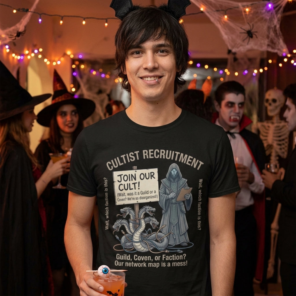 A man wearing a black graphic t-shirt with a Halloween-themed 'Cultist Recruitment' design, standing in a decorated party setting with string lights, cobwebs, and other costumed people in the background.