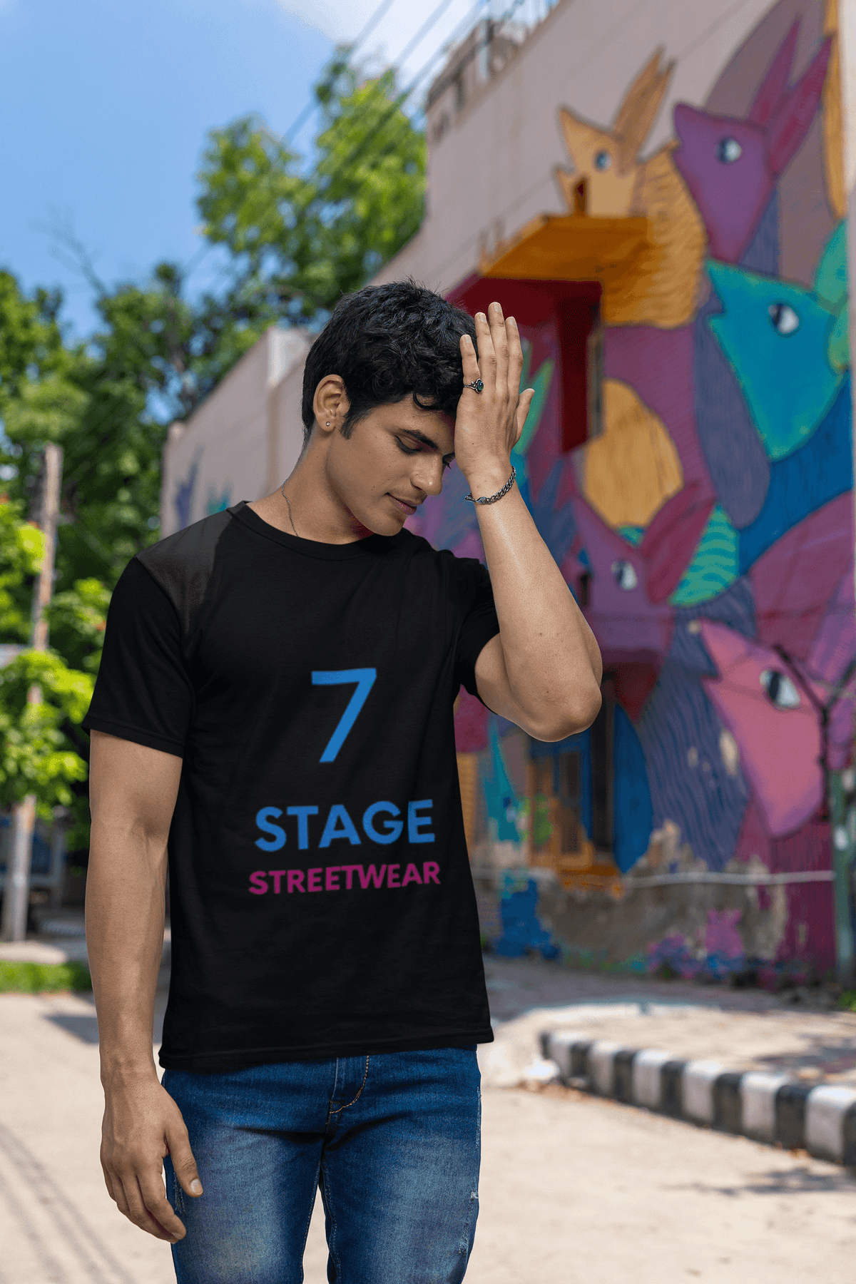 7 Stage Streetwear graphic t-shirt worn by worried man holding forehead