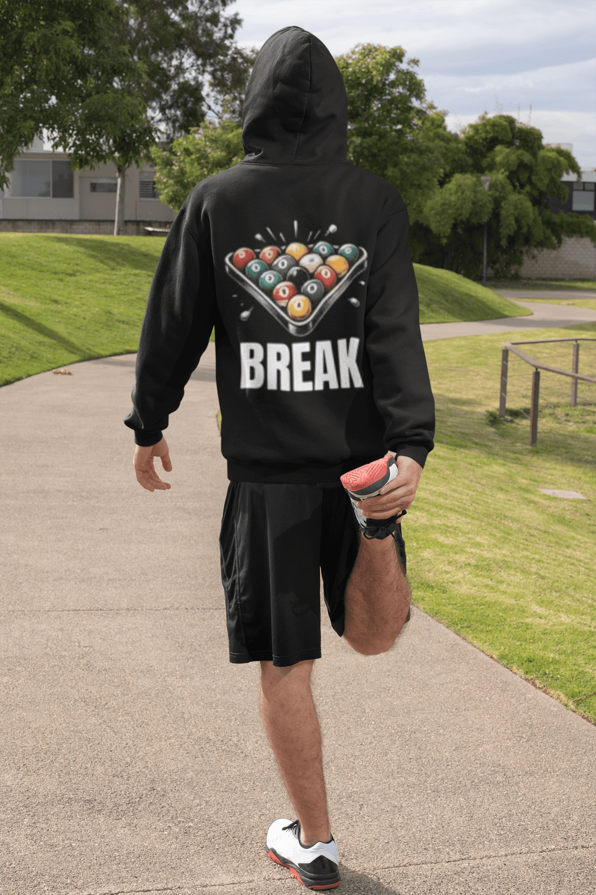 Break The Rack billiards hoodie back view worn by a man outdoors, back view