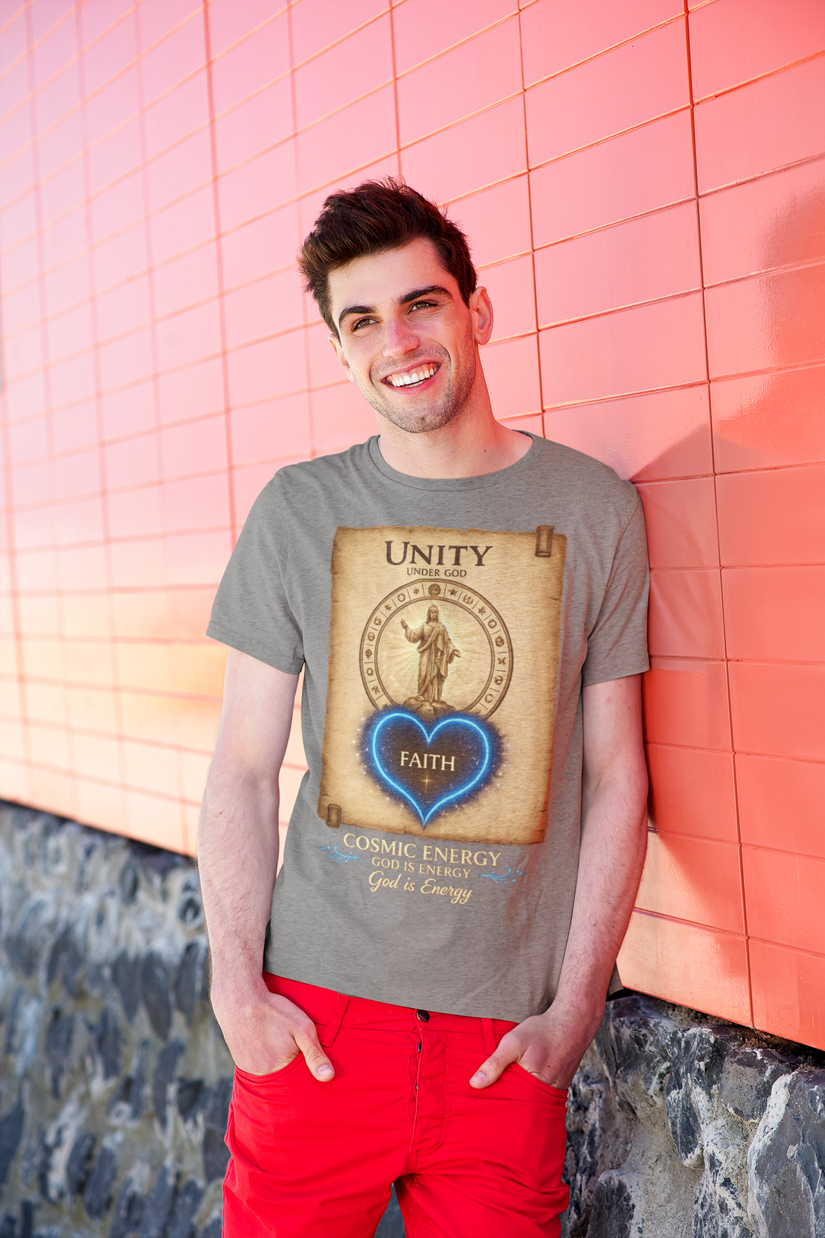 God Is Energy Christian streetwear graphic t-shirt worn by man leaning over colorful wall