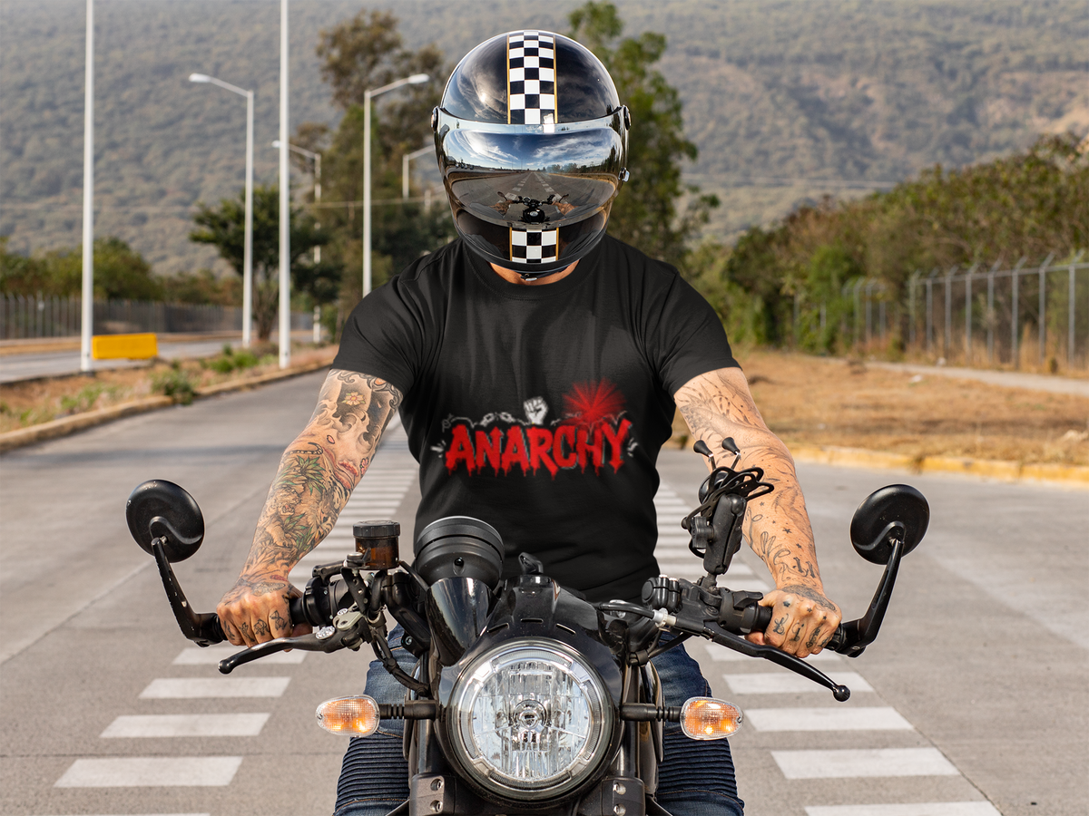 Anarchy Classic anti-establishment t-shirt worn by a tattooed man riding a motorcycle