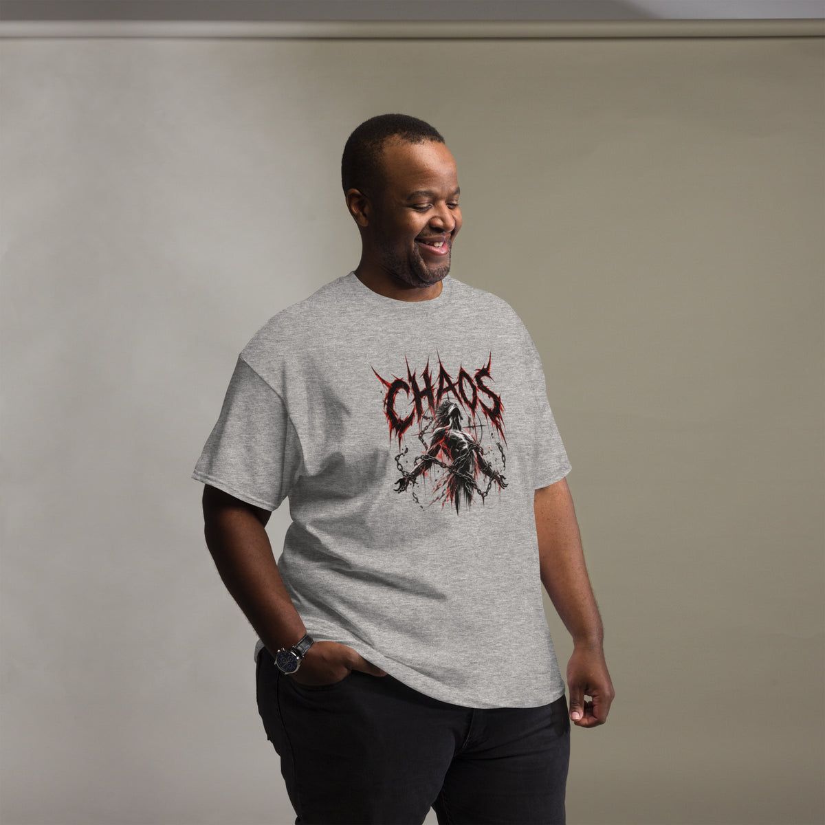 A man wearing a gray tee the man in chaos graphic tee