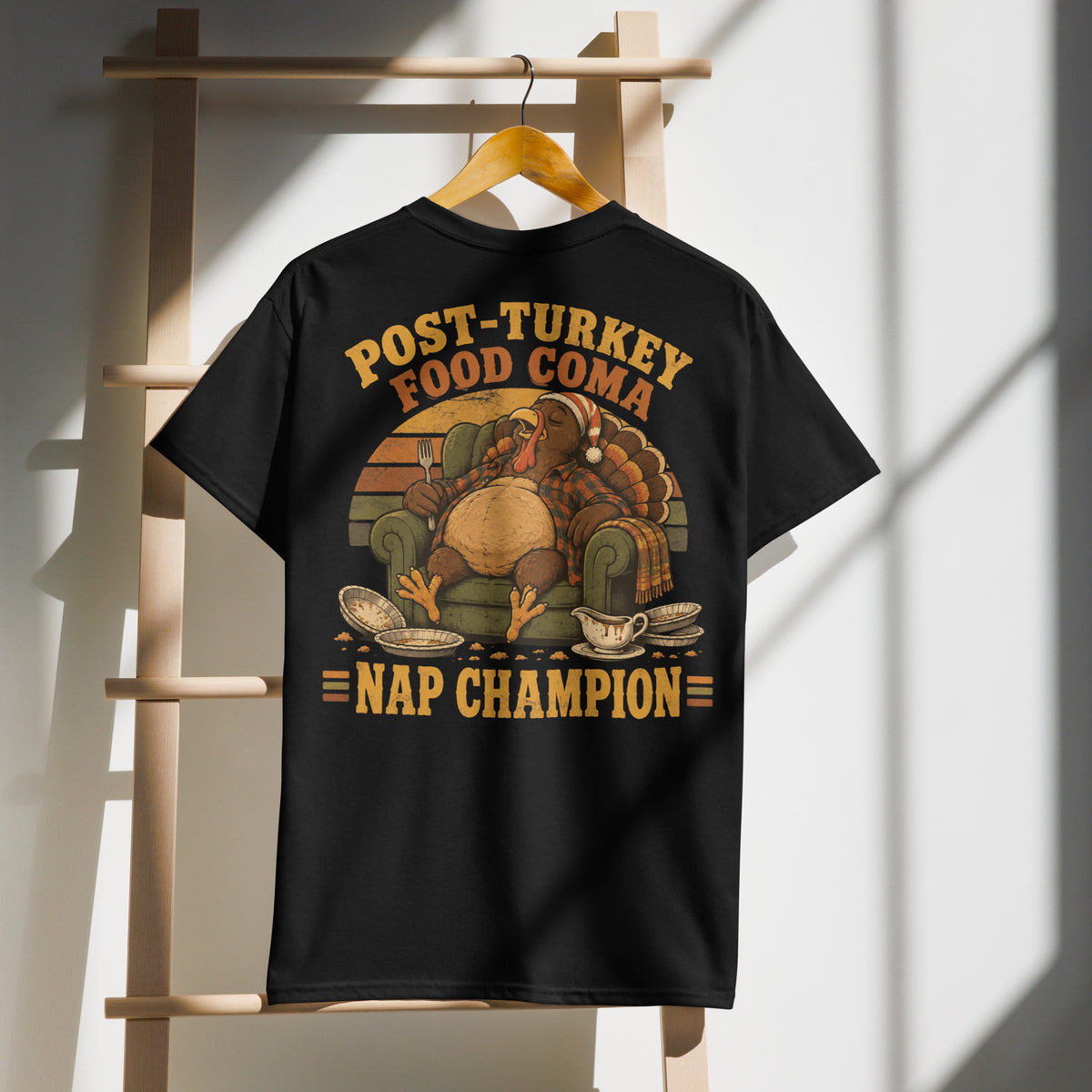 Post-Turkey Food Coma Nap Champion tee with a turkey asleep in an armchair — alternate view