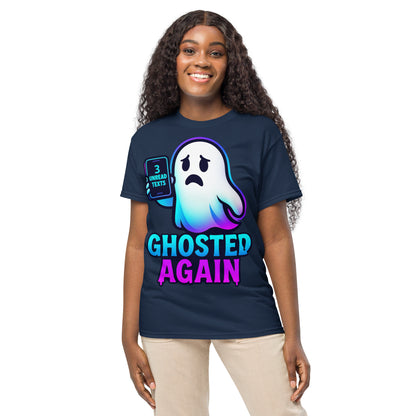 A woman modeling a navy blue graphic t-shirt with a cartoon ghost and the text 'GHOSTED AGAIN' in neon blue and pink, paired with beige pants, against a plain white background.