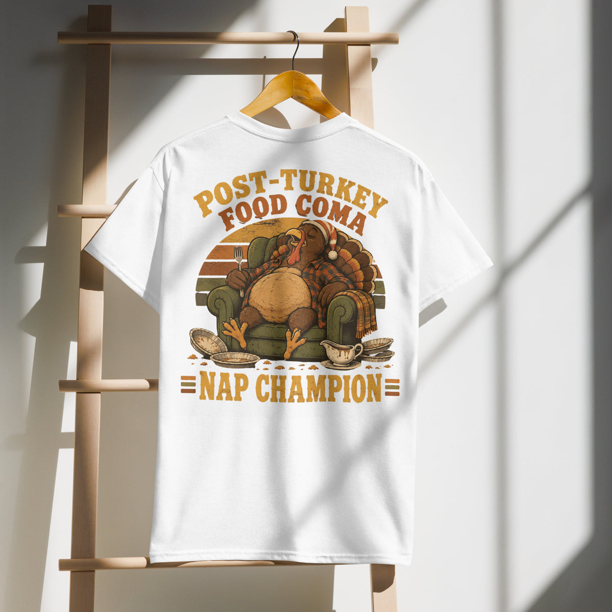 Post-Turkey Food Coma Nap Champion tee with a turkey asleep in an armchair — alternate view